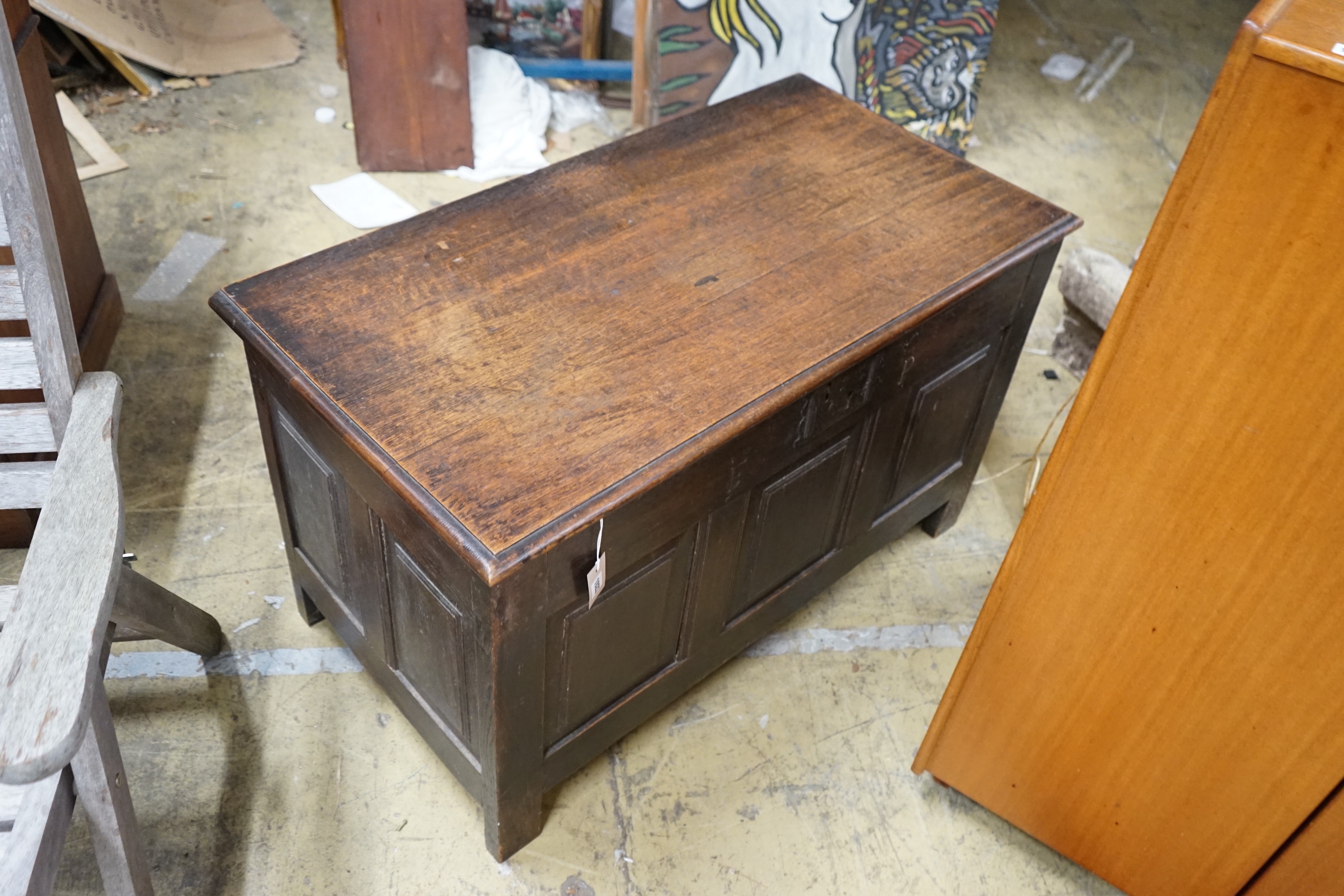 An 18th century style panelled oak coffer, length 107cm, depth 55cm, height 63cm